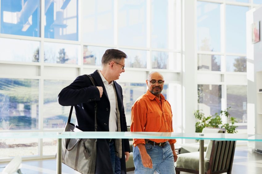 A salesperson walking with a prospect